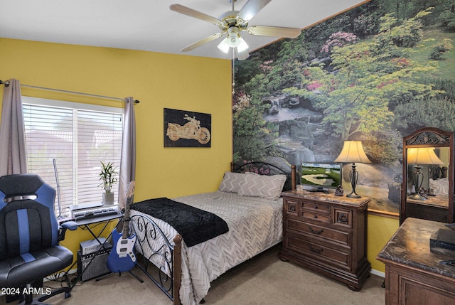 bedroom with light carpet and ceiling fan