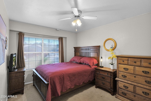 bedroom featuring ceiling fan and light colored carpet