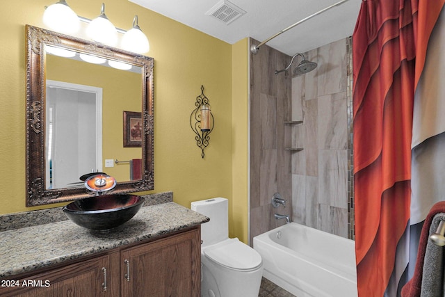 full bathroom featuring vanity, toilet, and shower / tub combo