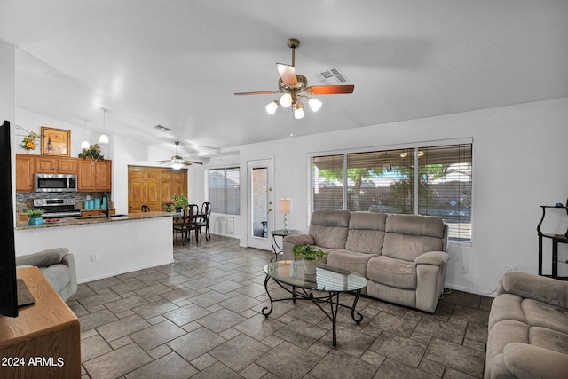 living room with vaulted ceiling and ceiling fan