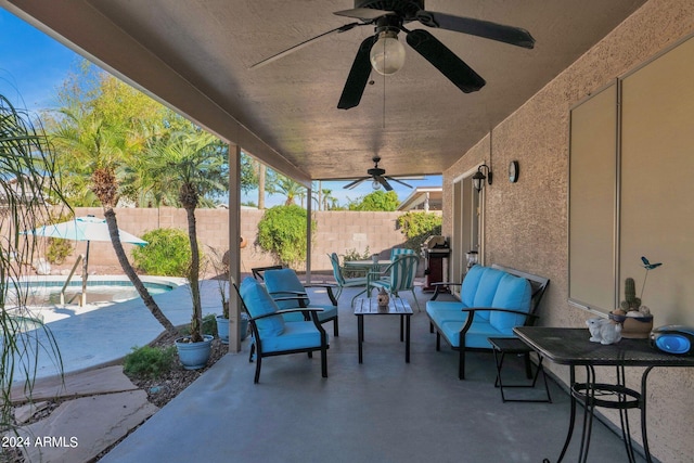 view of patio with a fenced in pool, an outdoor living space, and ceiling fan