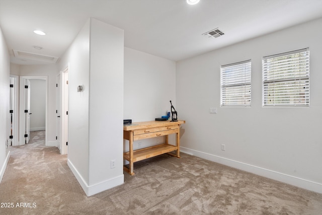 interior space with baseboards, carpet flooring, visible vents, and attic access