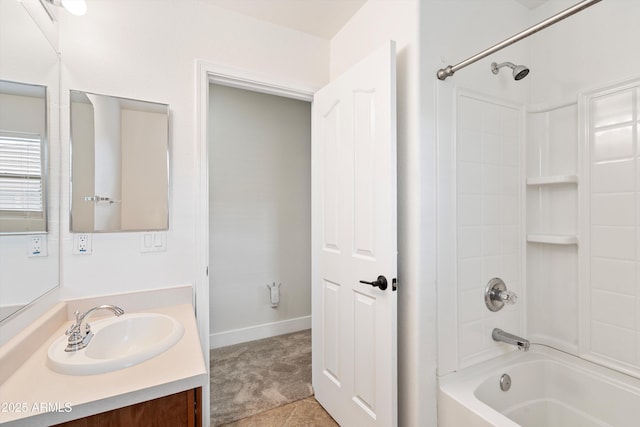 bathroom featuring bathtub / shower combination, baseboards, and vanity