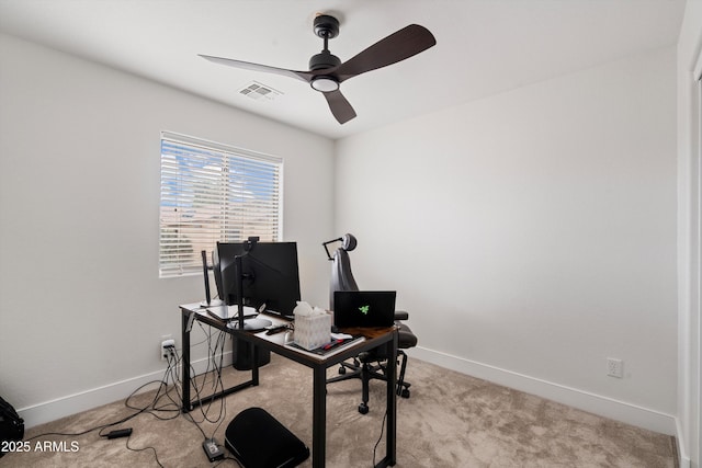 carpeted office with ceiling fan, visible vents, and baseboards