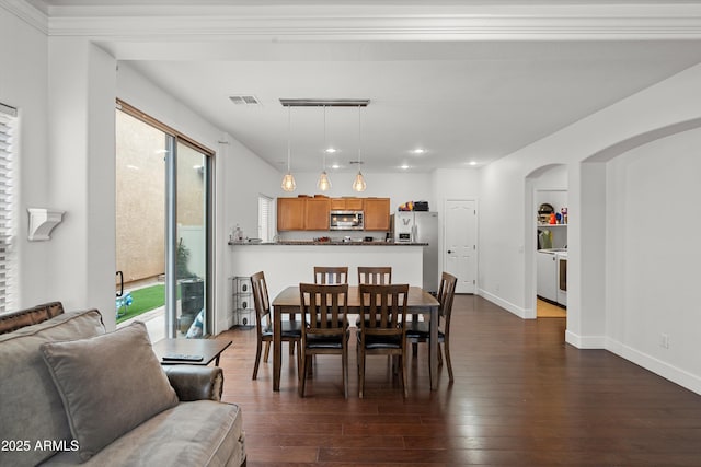 dining area with arched walkways, recessed lighting, visible vents, baseboards, and dark wood-style floors