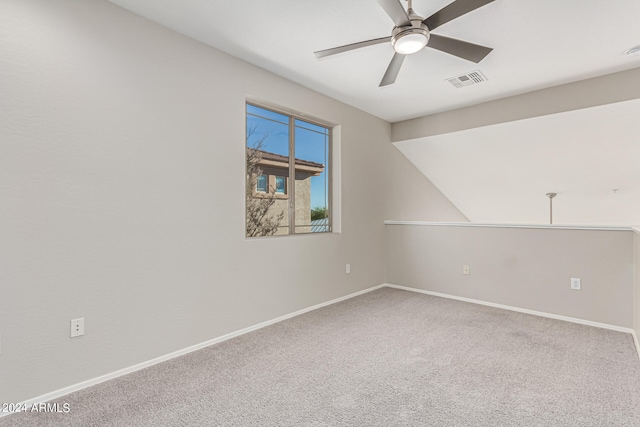 empty room with ceiling fan and carpet flooring