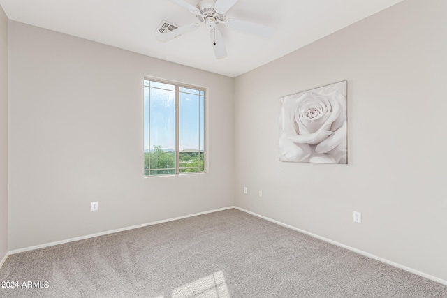 spare room with carpet flooring and ceiling fan