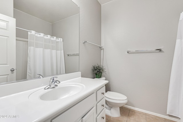 bathroom featuring vanity, toilet, and tile patterned flooring