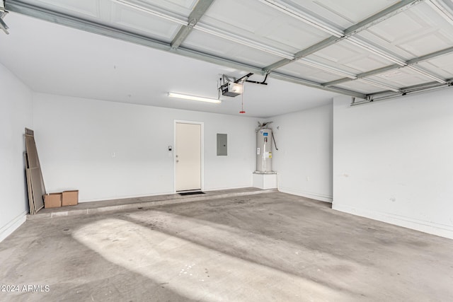 garage featuring a garage door opener, electric panel, and water heater