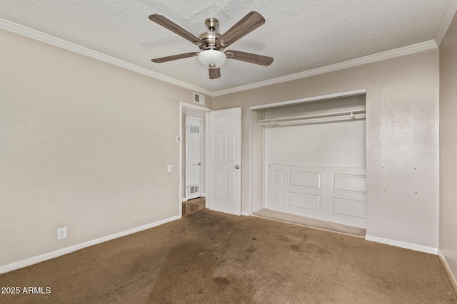 unfurnished bedroom featuring crown molding, a closet, visible vents, carpet flooring, and a textured ceiling