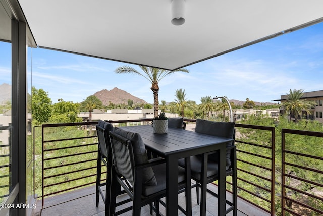 balcony featuring a mountain view