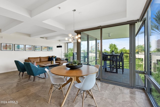 dining area featuring beamed ceiling, a wall of windows, a wealth of natural light, and a chandelier