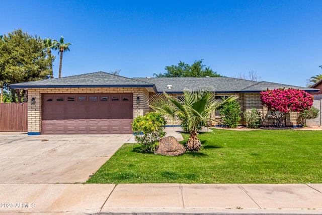 single story home with an attached garage, a front lawn, brick siding, and concrete driveway