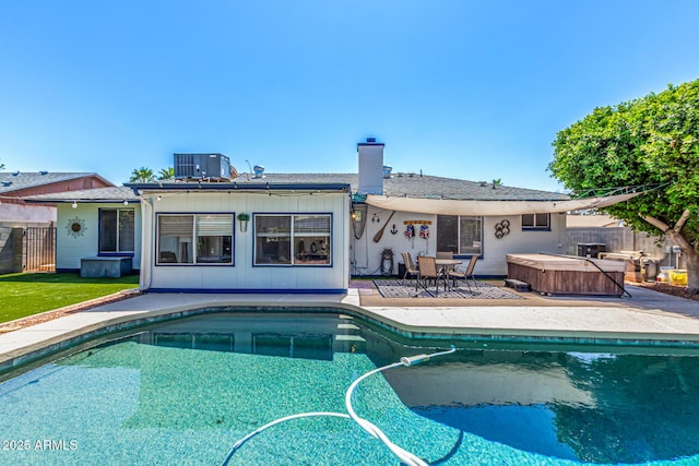 view of swimming pool with a fenced in pool, a hot tub, a patio area, and fence
