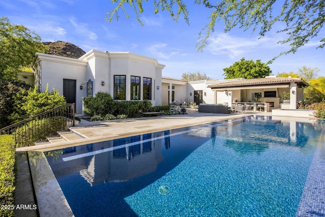 outdoor pool featuring a patio