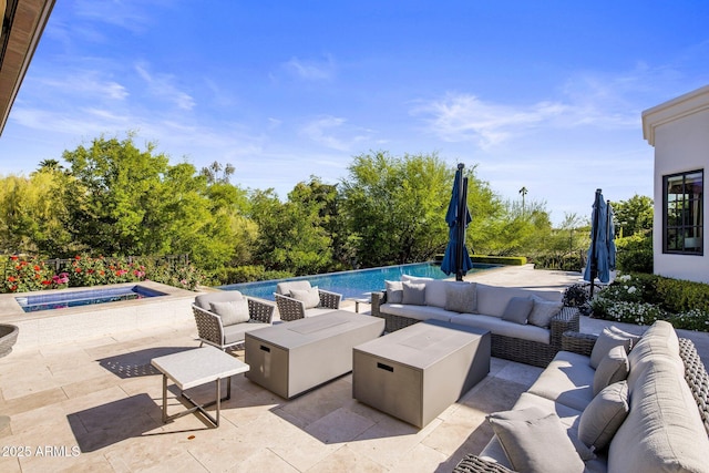 view of patio featuring an outdoor living space with a fire pit and an outdoor pool