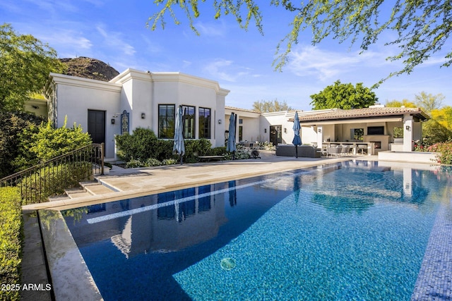 outdoor pool featuring an outdoor living space and a patio