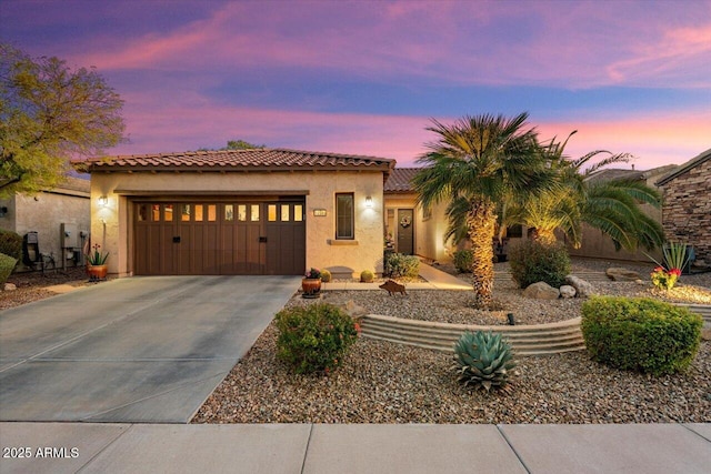 mediterranean / spanish-style home featuring a garage