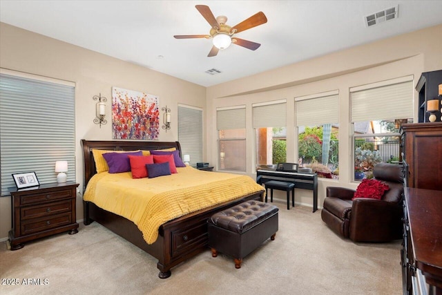 bedroom with light carpet and ceiling fan