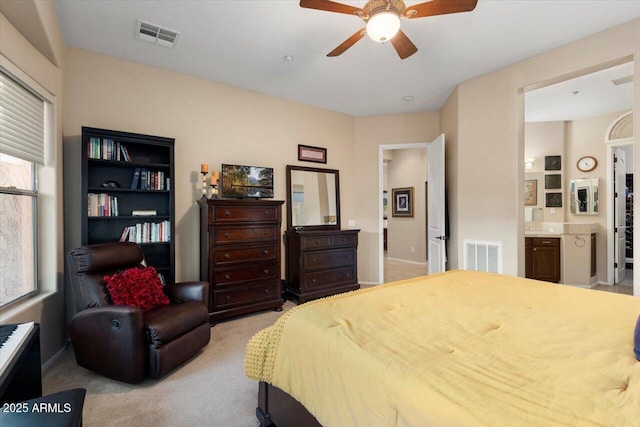 carpeted bedroom featuring ceiling fan and connected bathroom