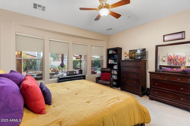 bedroom with light colored carpet and ceiling fan