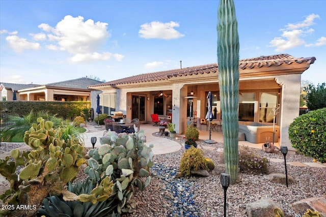 rear view of house featuring a patio area