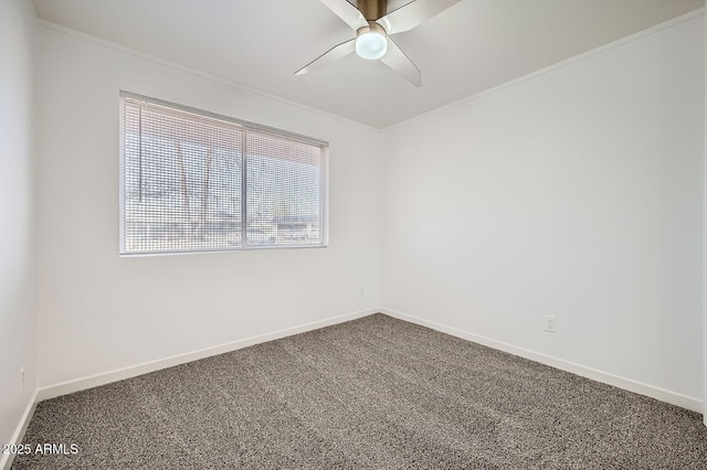 unfurnished room with a ceiling fan, carpet, ornamental molding, and baseboards