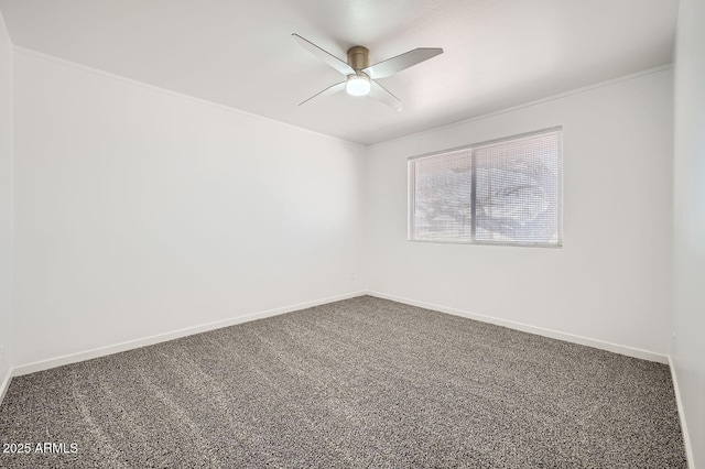 spare room featuring a ceiling fan, carpet, and baseboards