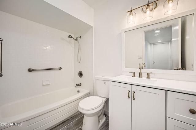 bathroom with toilet, tub / shower combination, and vanity