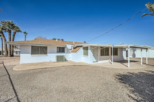 back of property featuring central air condition unit and a patio area
