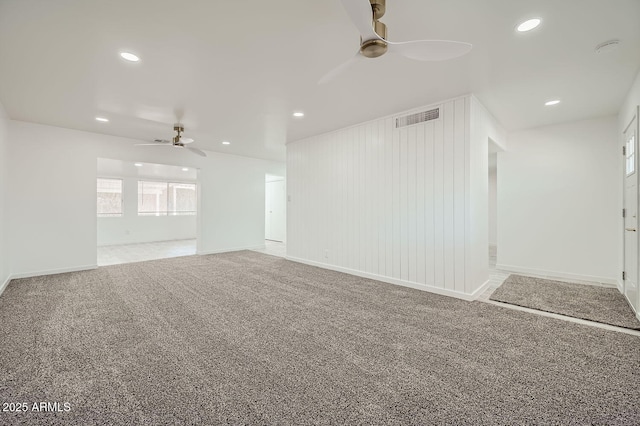 carpeted empty room with baseboards, recessed lighting, visible vents, and a ceiling fan
