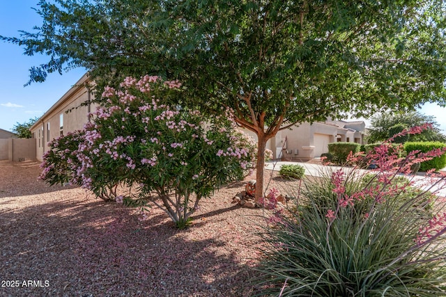 4741 E Fire Opal Ln, San Tan Valley, AZ 85143 - view of property exterior featuring stucco siding, fence, and an attached garage