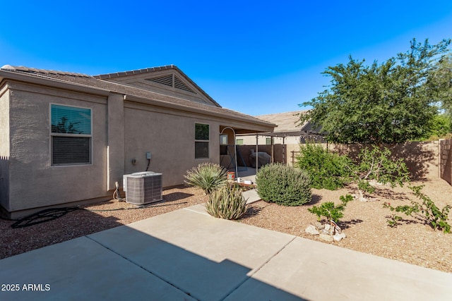 4741 E Fire Opal Ln, San Tan Valley, AZ 85143 - back of house with a patio area, stucco siding, and central air condition unit