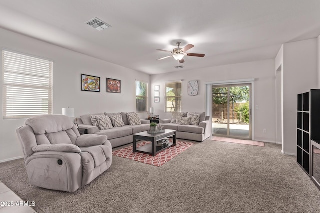4741 E Fire Opal Ln, San Tan Valley, AZ 85143 - living room with ceiling fan, healthy amount of natural light, baseboards, and carpet flooring
