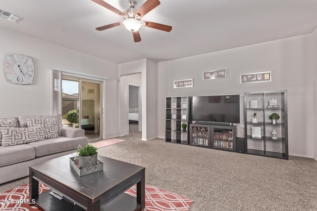 4741 E Fire Opal Ln, San Tan Valley, AZ 85143 - living room featuring carpet, ceiling fan, and baseboards
