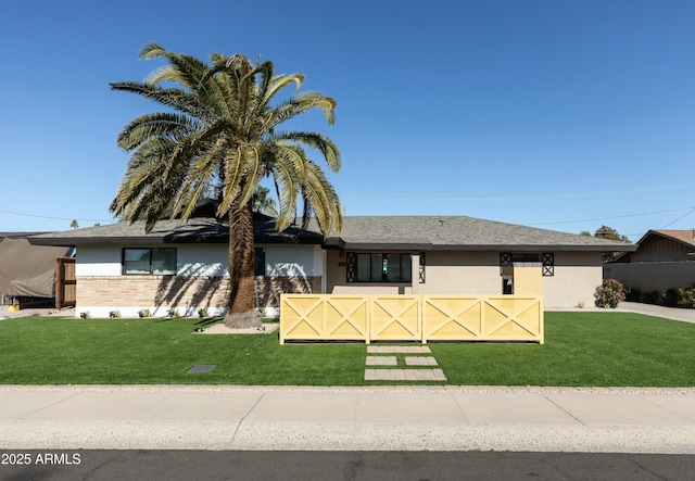 view of front facade with a front lawn