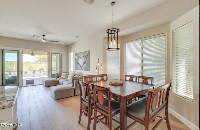 dining area featuring ceiling fan and light hardwood / wood-style floors