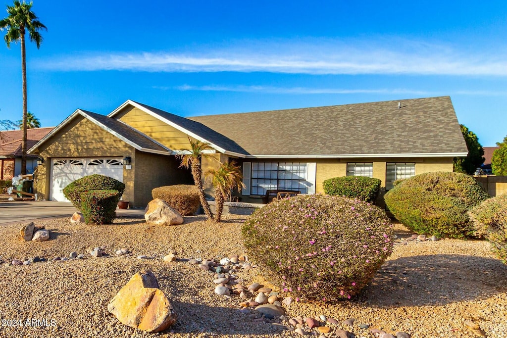 single story home with a garage