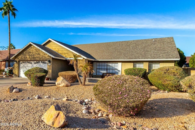 single story home with a garage