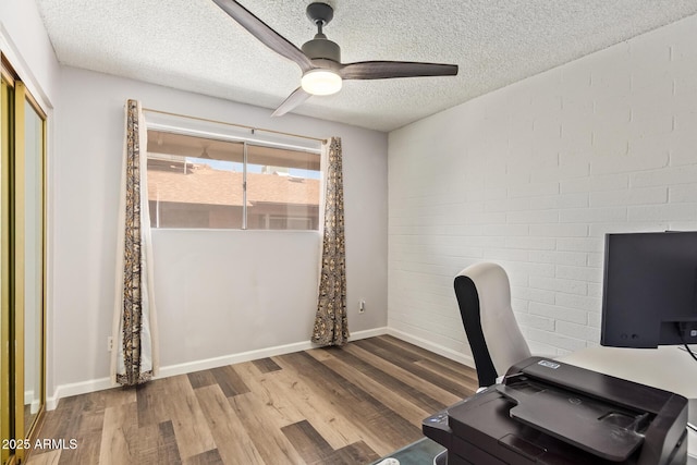 8538 E Portland St, Scottsdale, AZ 85257 - unfurnished office with ceiling fan, wood finished floors, a textured ceiling, and baseboards