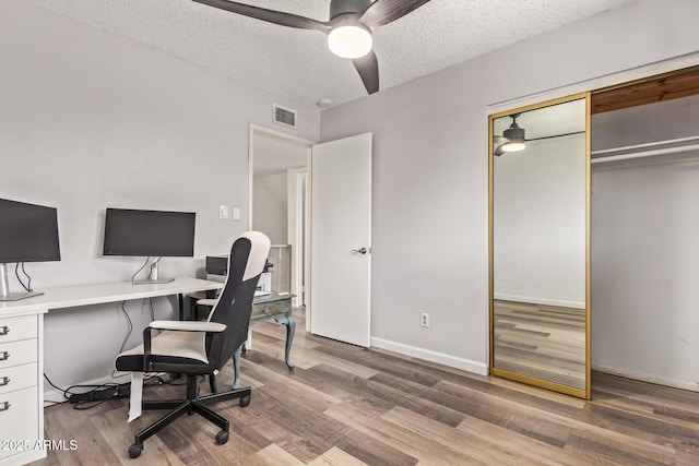 8538 E Portland St, Scottsdale, AZ 85257 - office featuring a ceiling fan, light wood finished floors, a textured ceiling, and baseboards