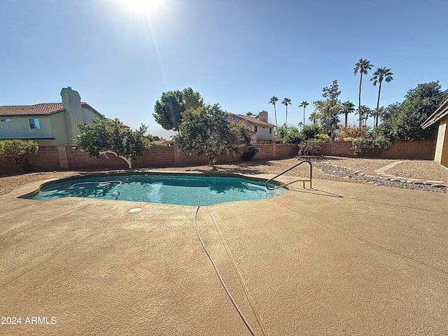 view of swimming pool with a patio area