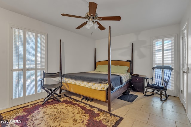 tiled bedroom with ceiling fan