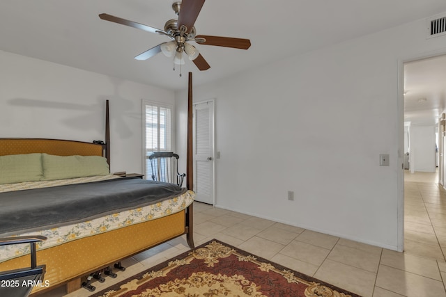 bedroom featuring light tile patterned floors and ceiling fan