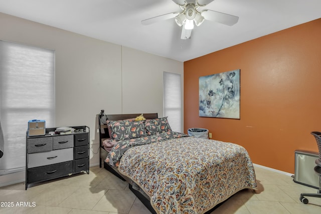 tiled bedroom with ceiling fan