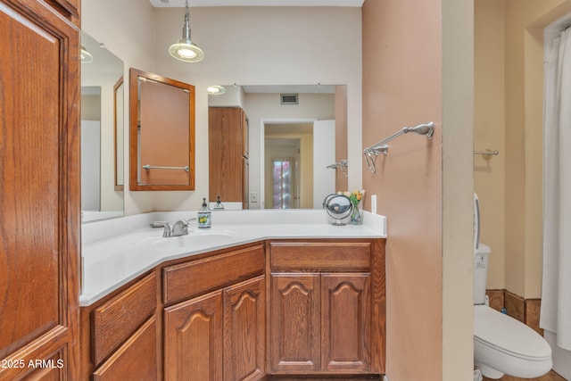 bathroom with vanity and toilet