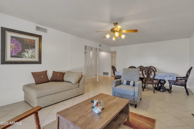 tiled living room with ceiling fan