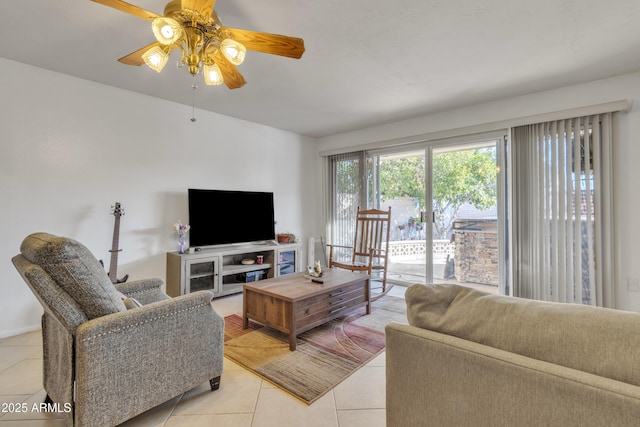 tiled living room with ceiling fan