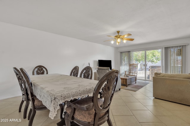 dining area featuring light tile patterned flooring and ceiling fan