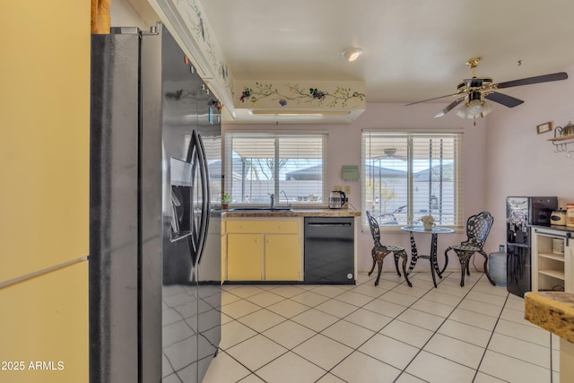 kitchen featuring dishwasher, sink, light tile patterned flooring, and stainless steel fridge with ice dispenser